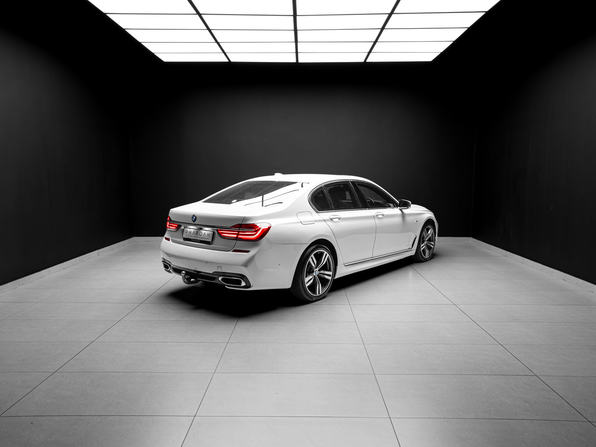 white bmw 750i 12