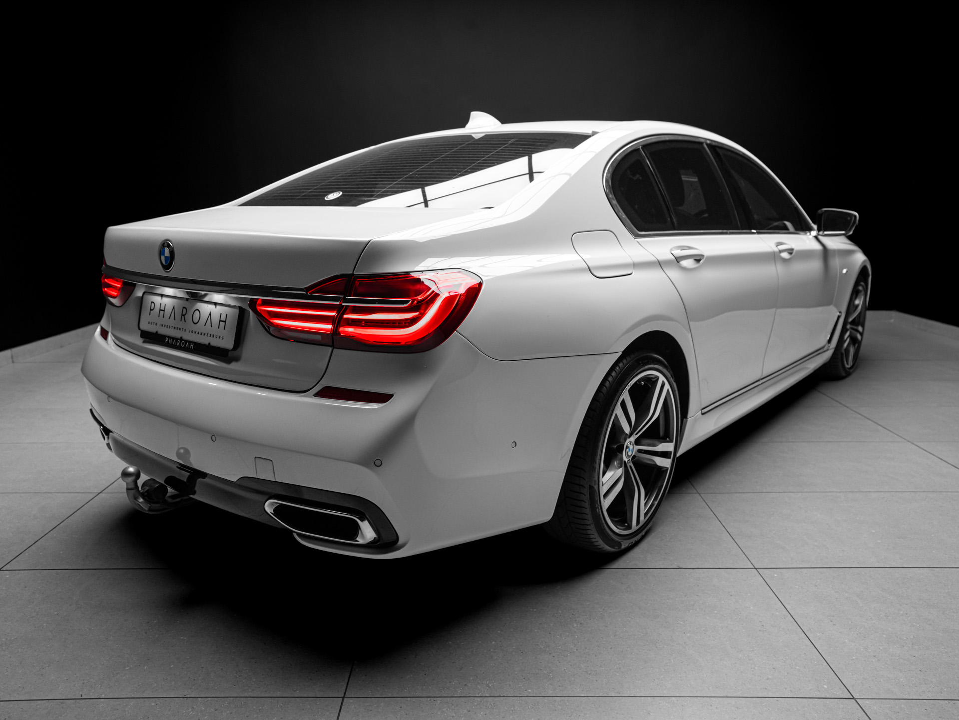white bmw 750i 14