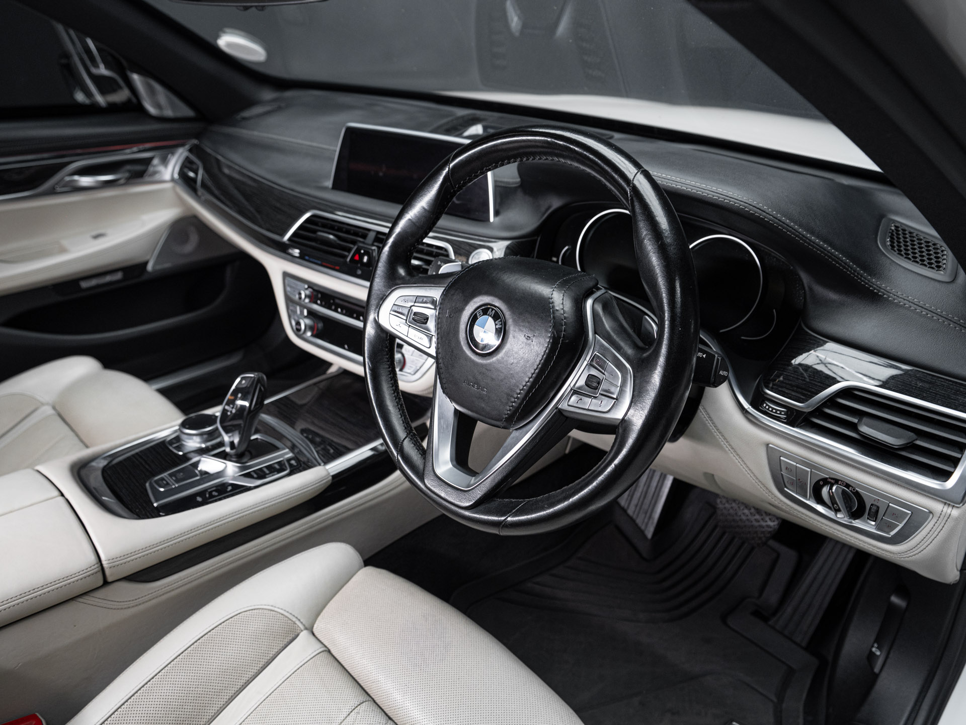 white bmw 750i 18