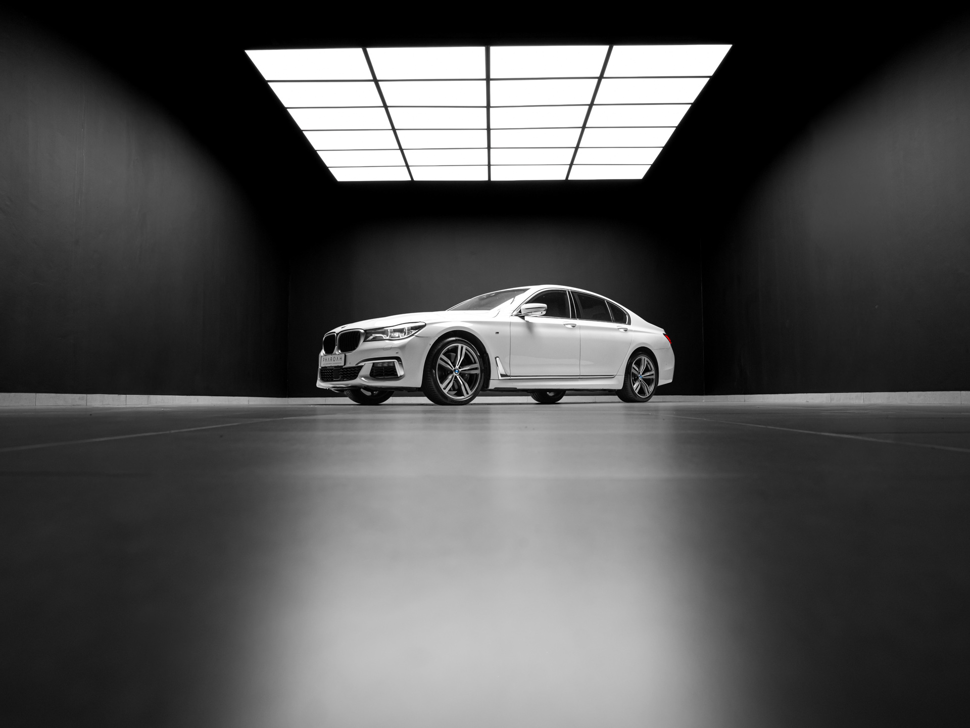 white bmw 750i 2