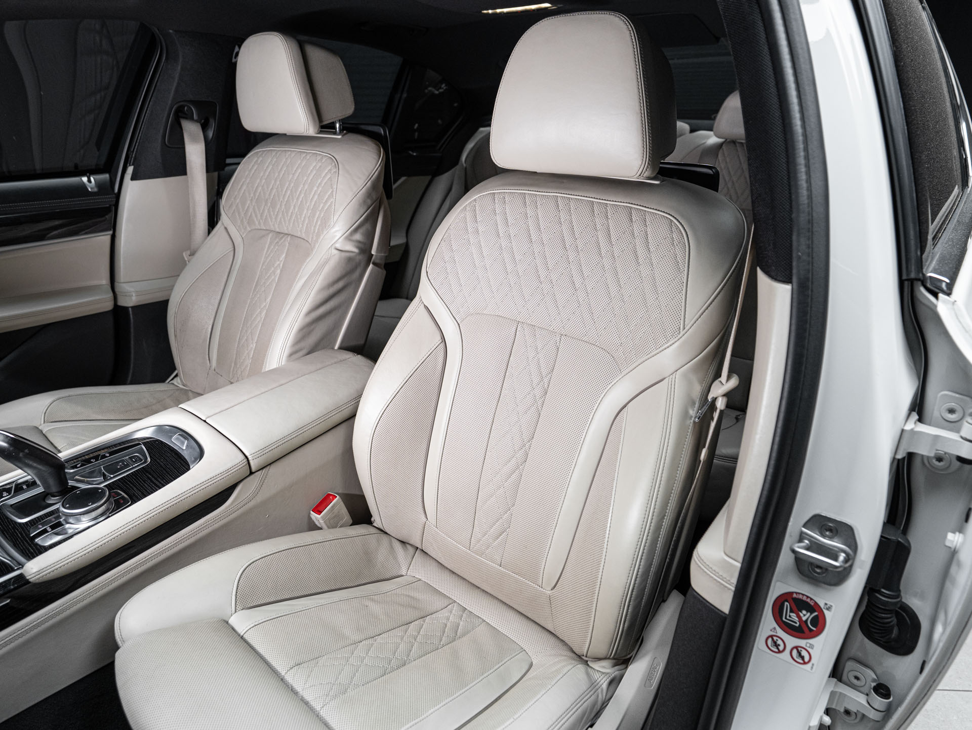 white bmw 750i 26