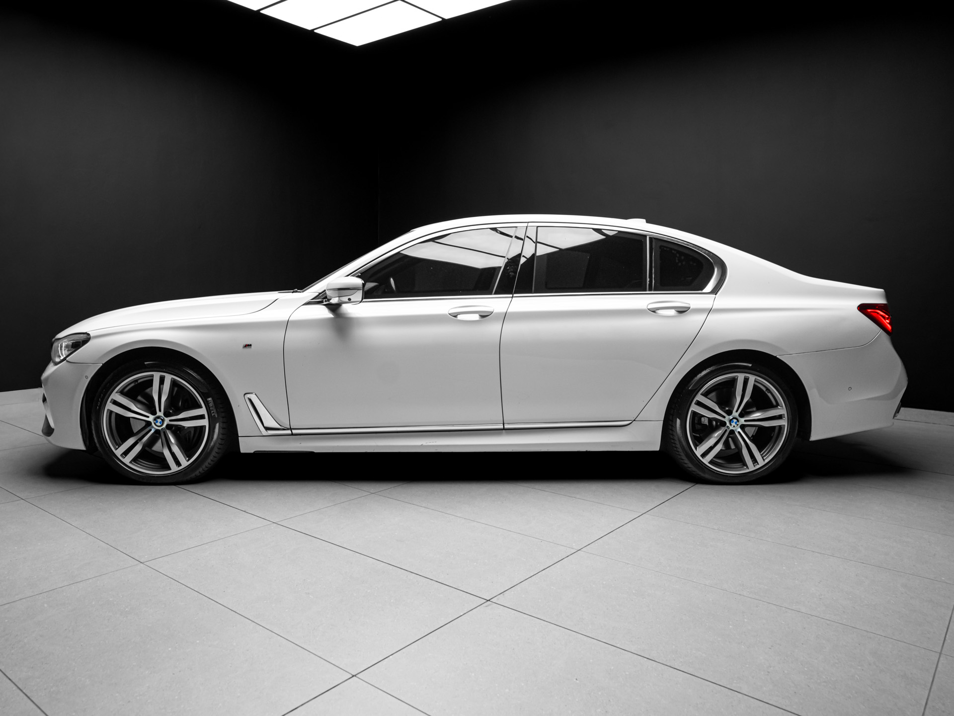 white bmw 750i 3