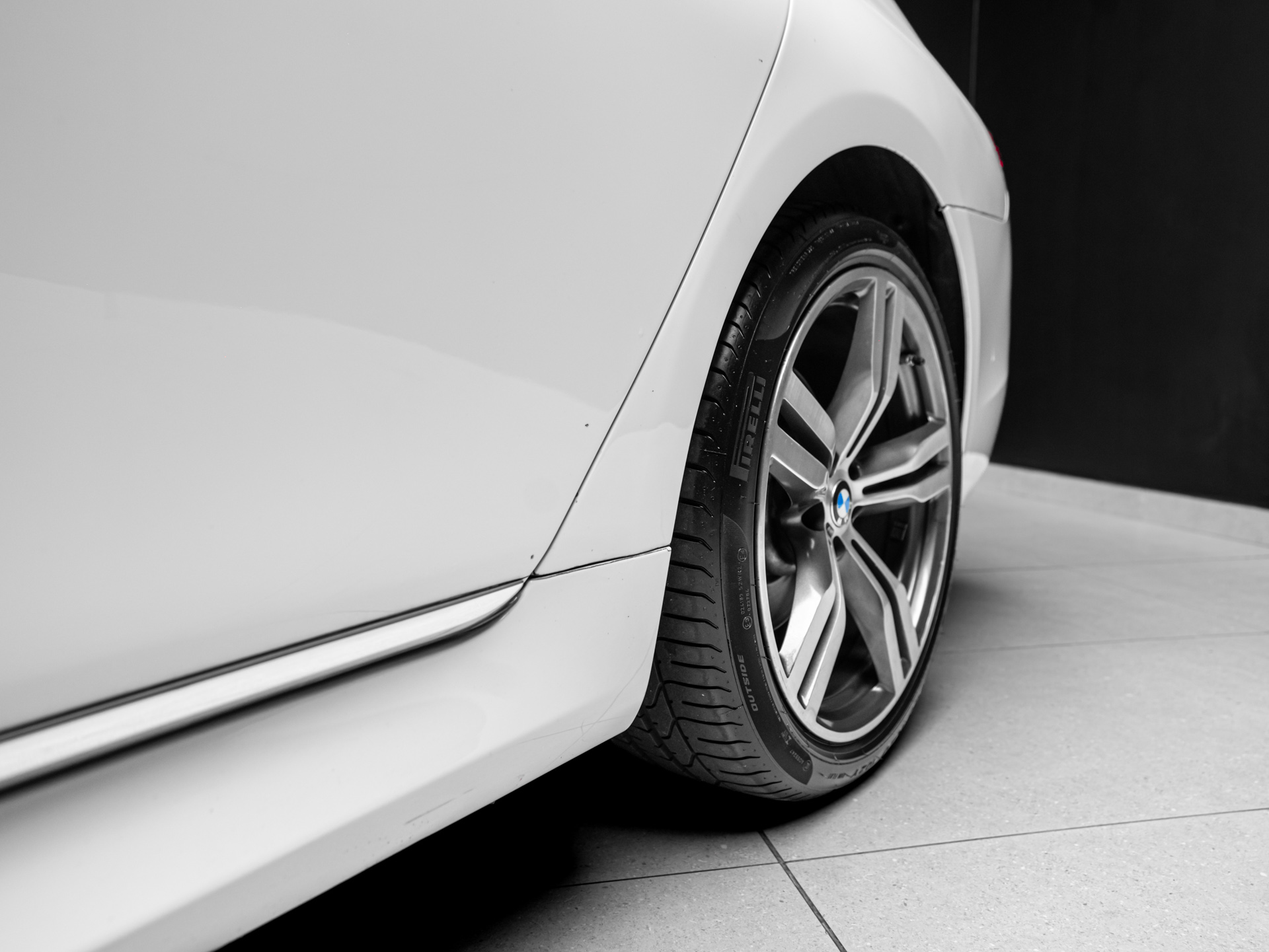 white bmw 750i 6