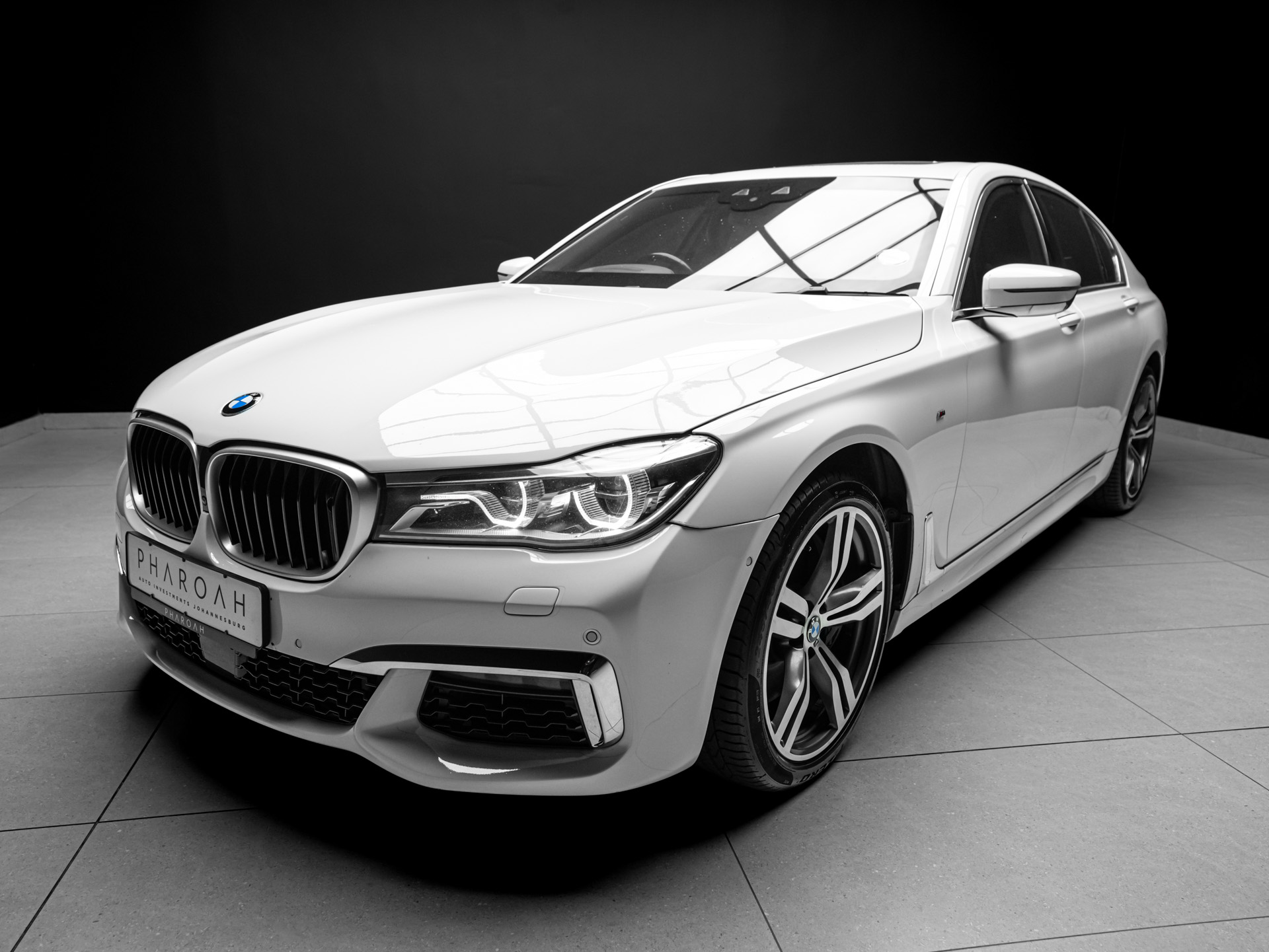 white bmw 750i 8