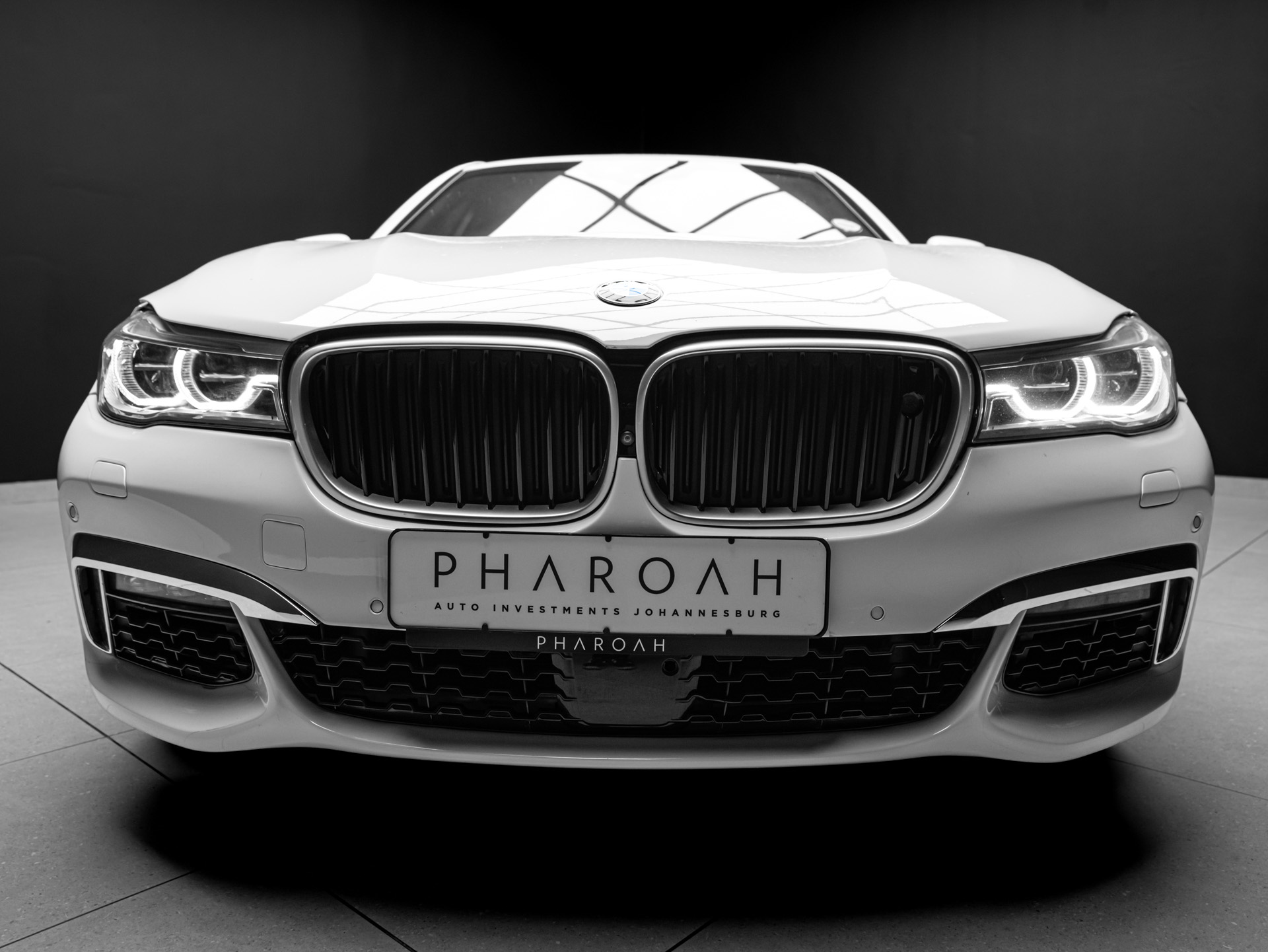 white bmw 750i 9