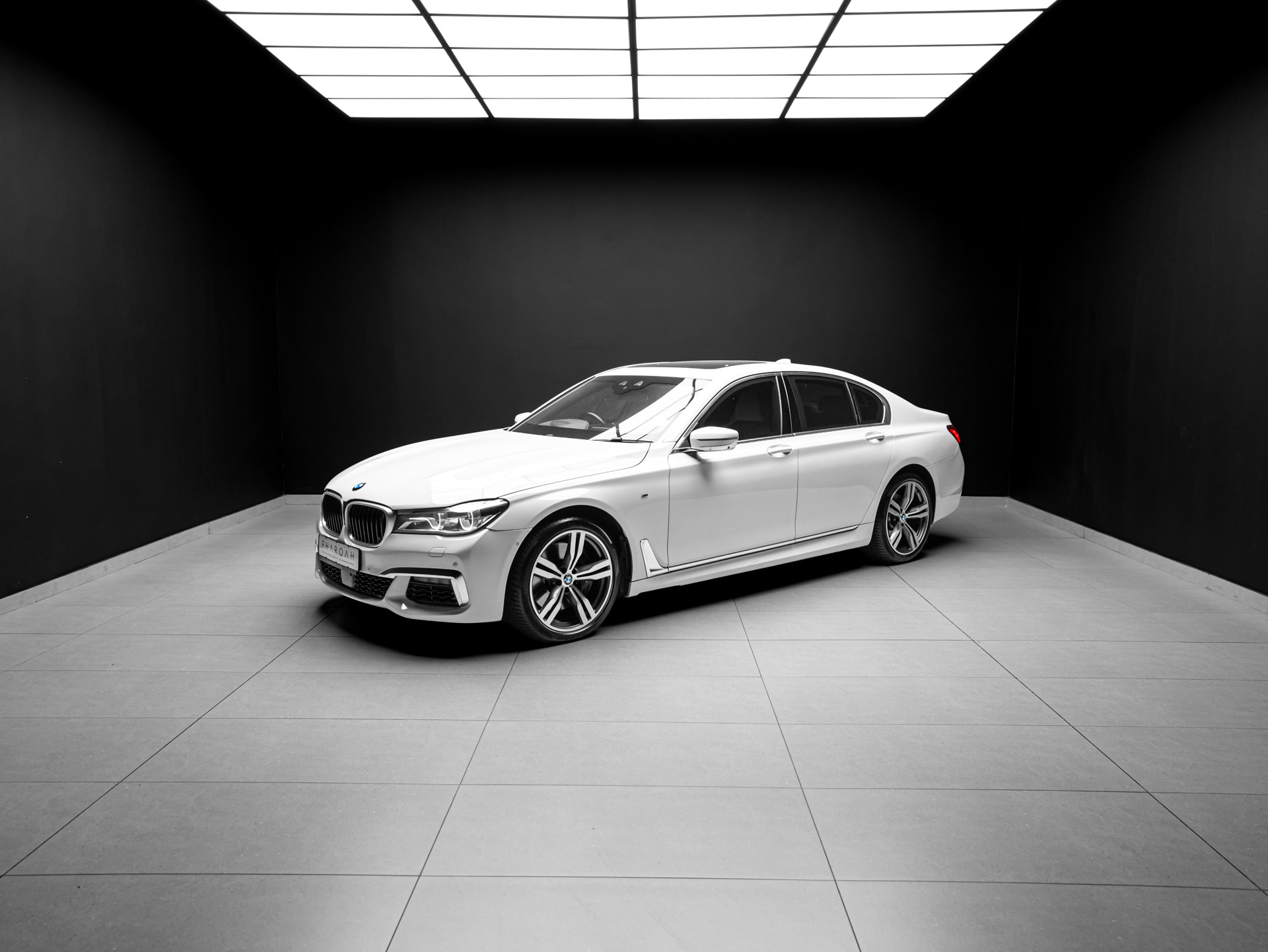 white bmw 750i