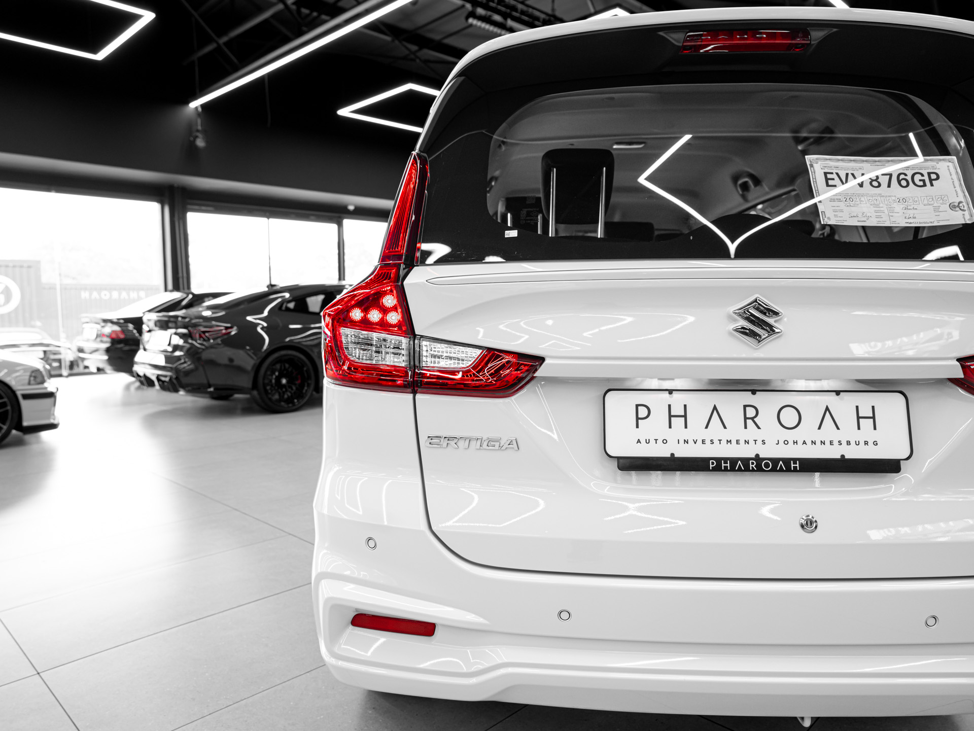 white suzuki ertiga 12