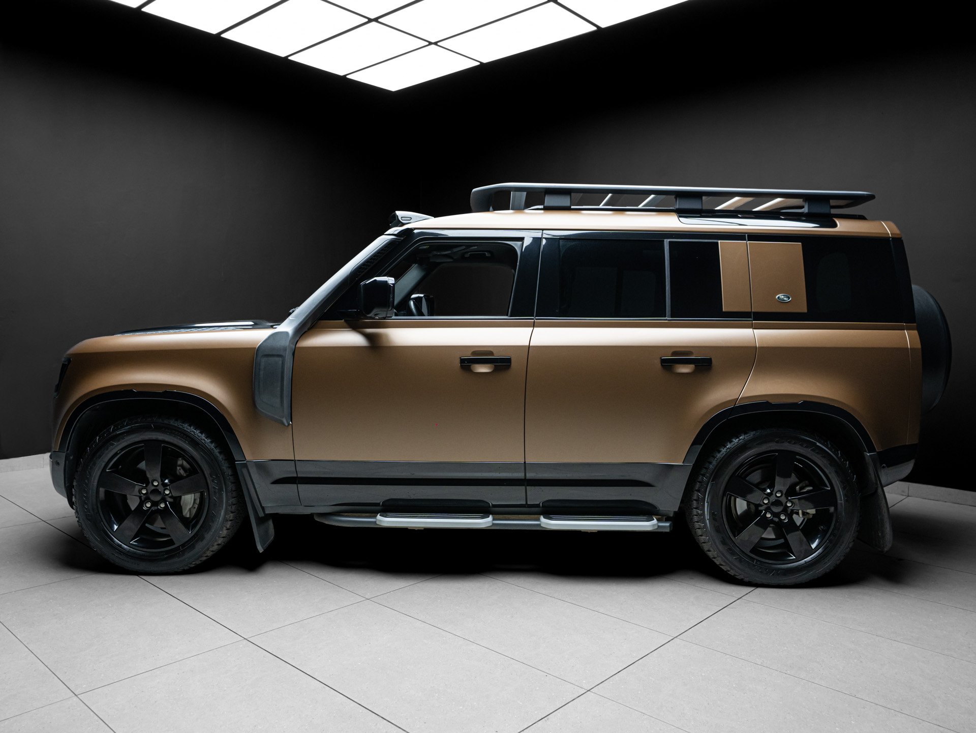 brown land rover defender d300 2