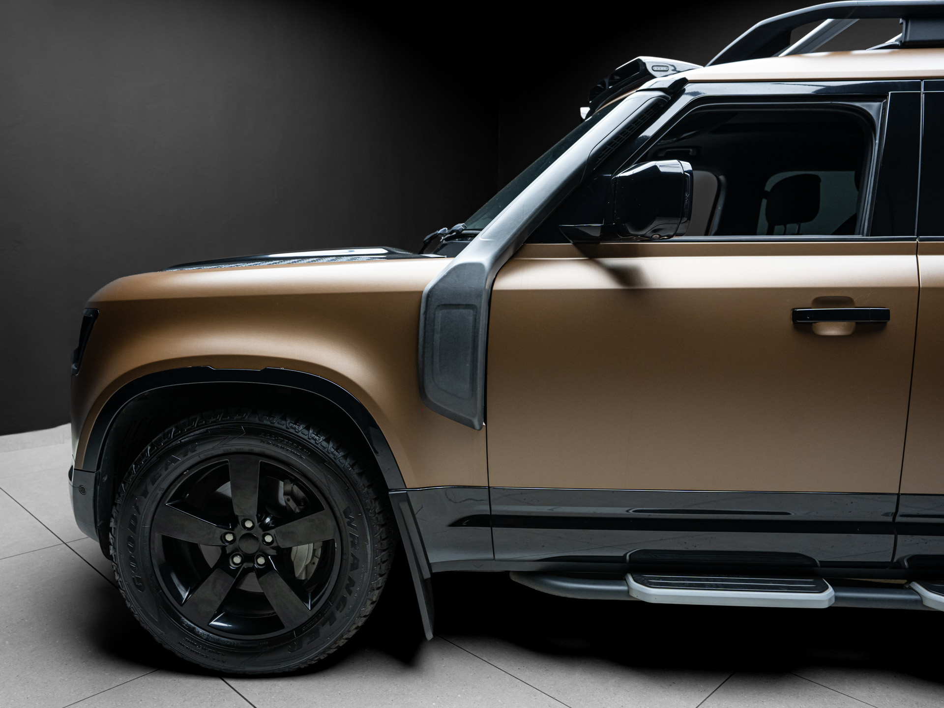 brown land rover defender d300 3