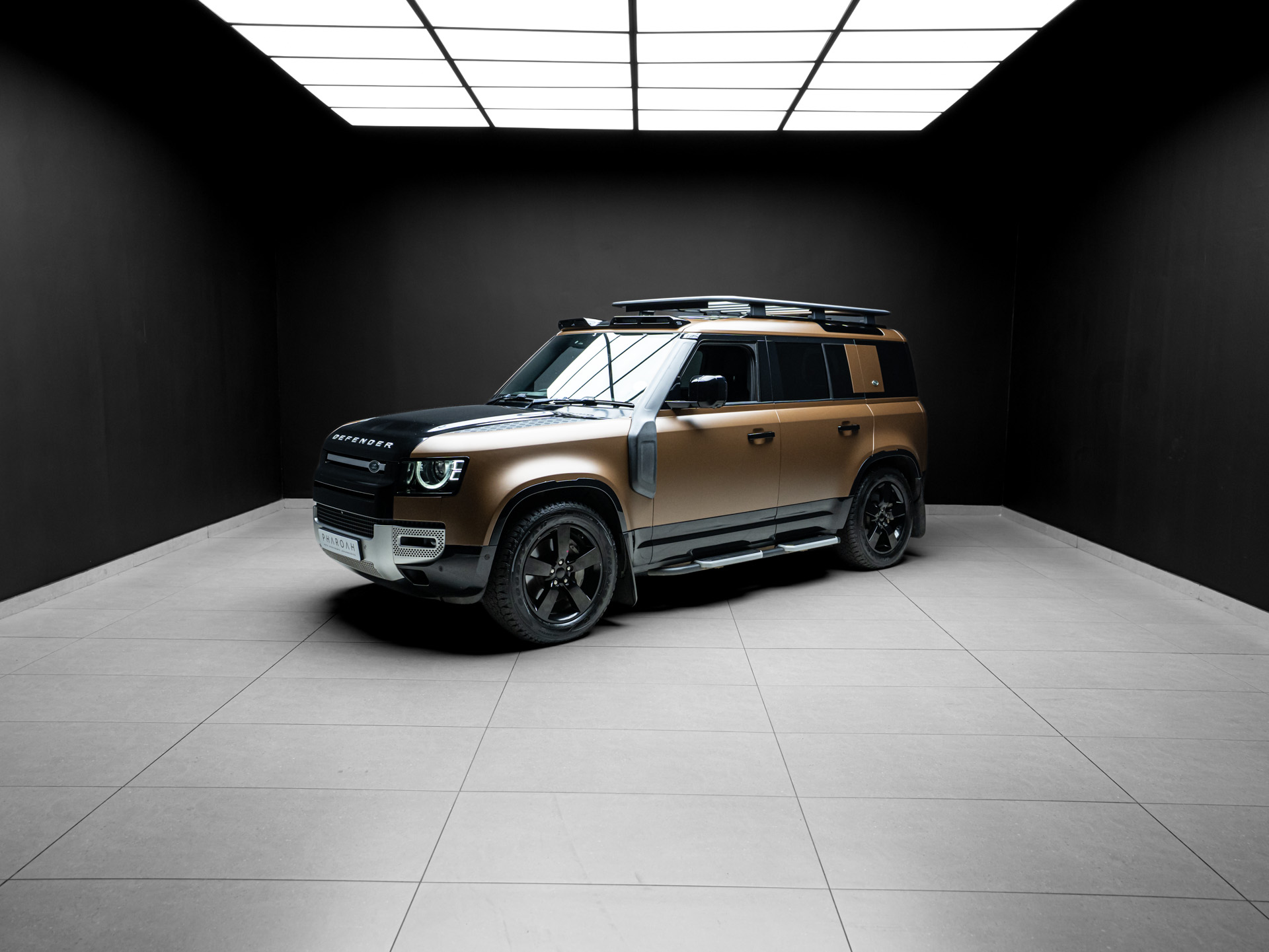brown land rover defender d300