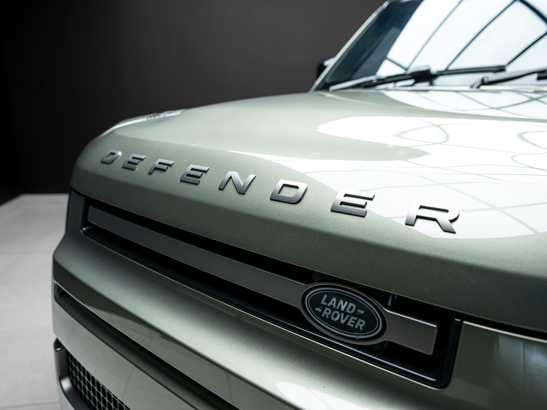green land rover defender 10