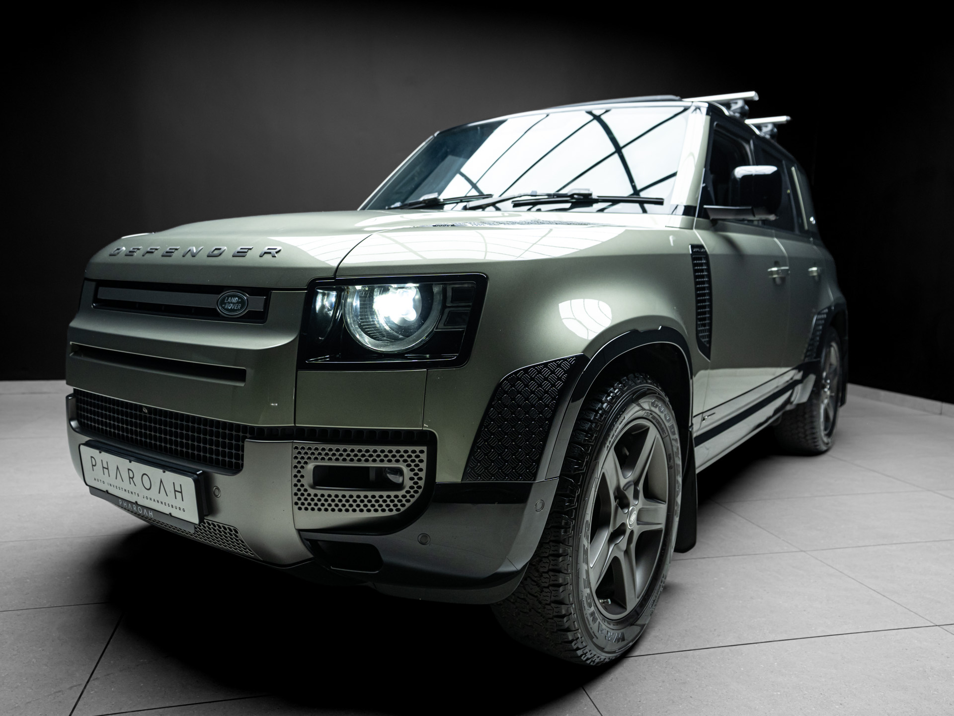 green land rover defender 7